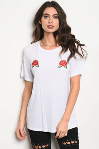 Ladies fashion short sleeve light weight t-shirt with a crew neckline and floral patch details
