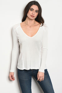 Ladies fashion long sleeve relaxed fit thermal top that features a v neckline