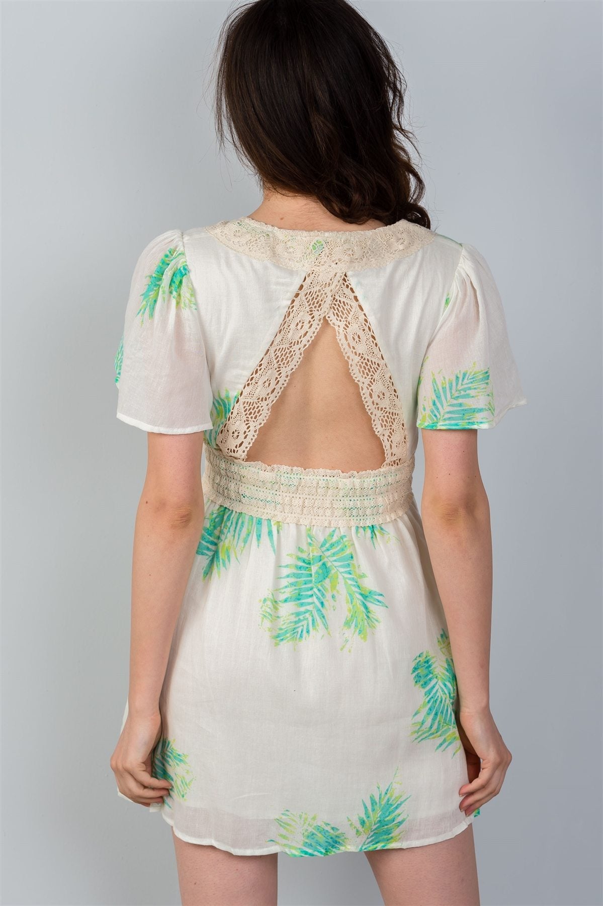 Ladies fashion crochet trim detail neckline button leaf print back cut-out mini dress