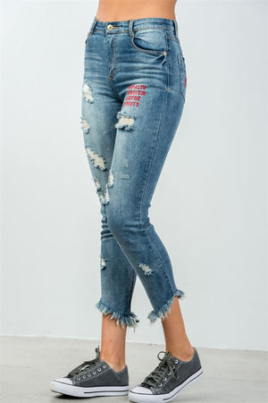 Ladies fashion denim distressed & graphic frayed hem skinny jeans