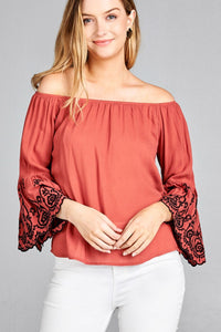 Ladies fashion 3/4 sleeve w/floral embo scallop hem off the shulder woven top