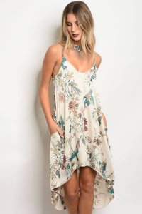 Ladies fashion sleeveless floral print satin slip style dress with a  v- neckline and a hi-low loose fit cut
